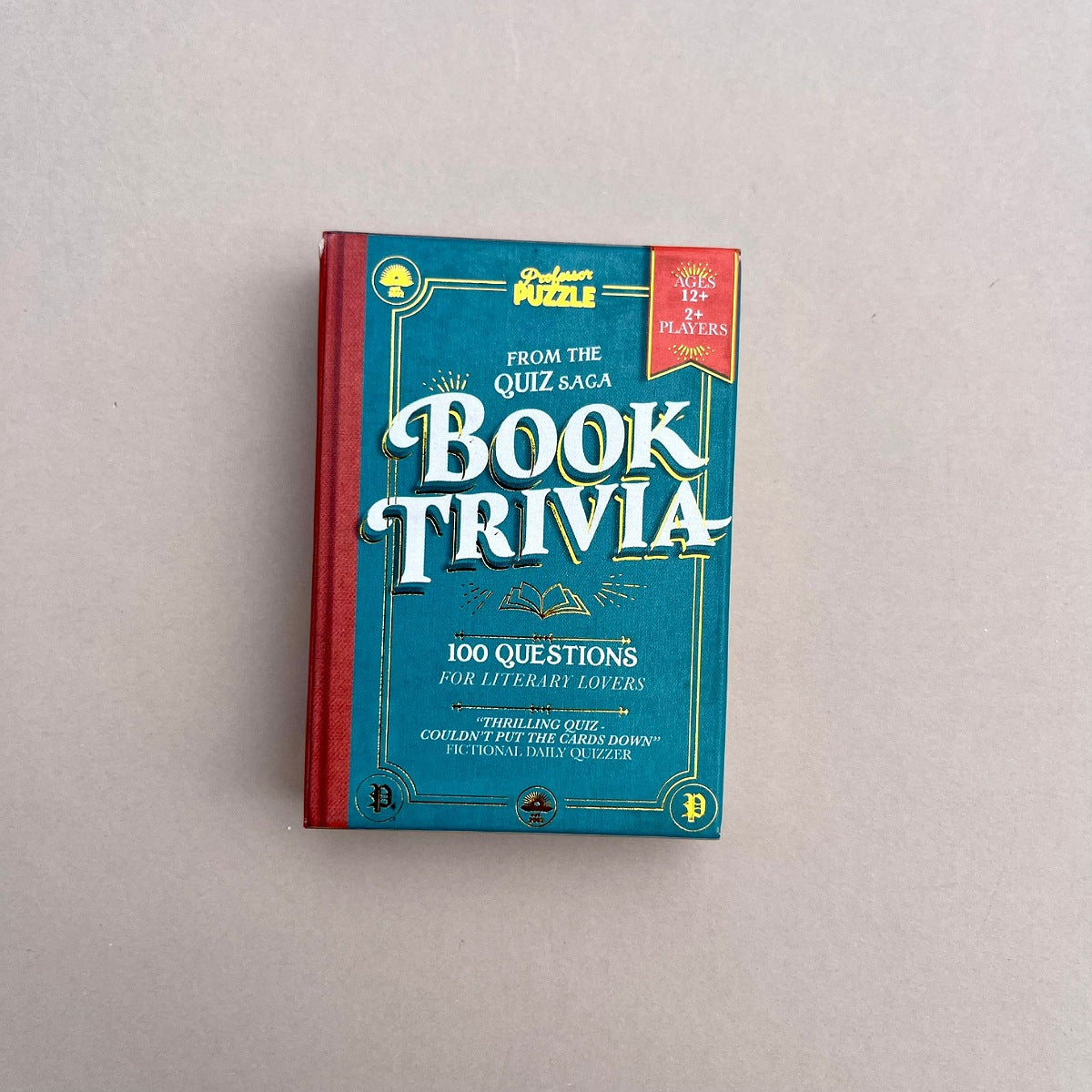 Book of trivia on a plain background