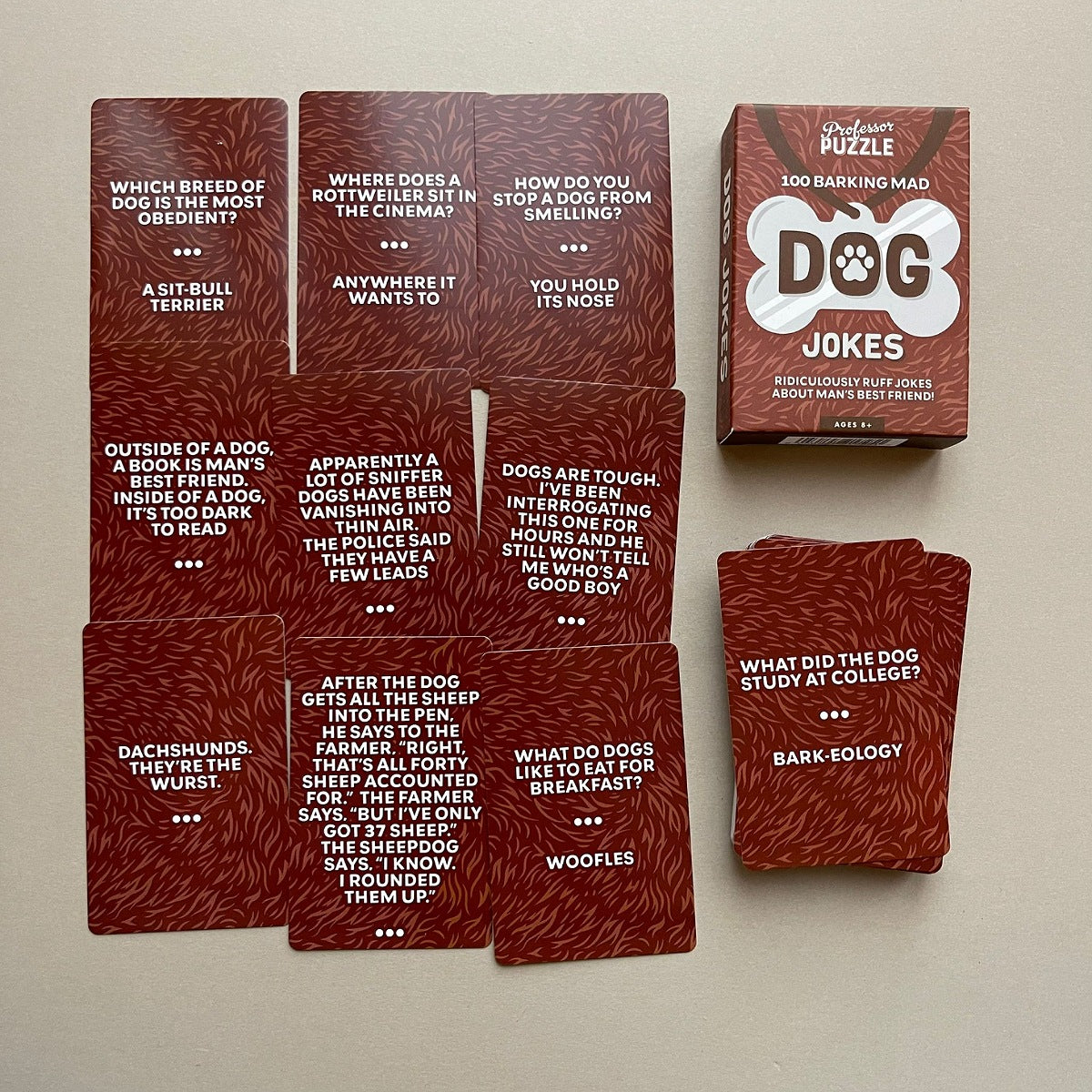 Set of dog-themed joke cards on a beige background