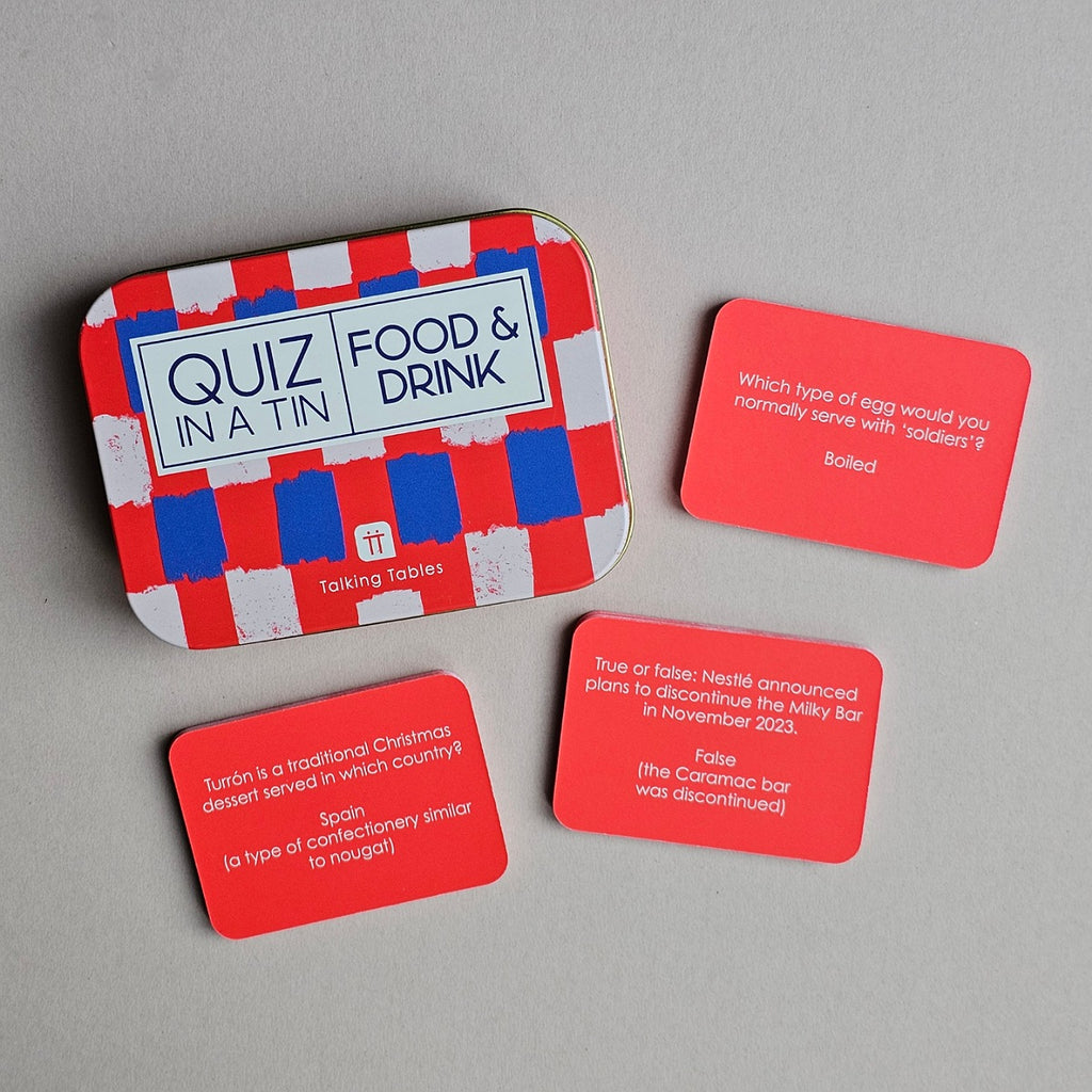 Quiz in a Tin game with red question cards on a gray background
