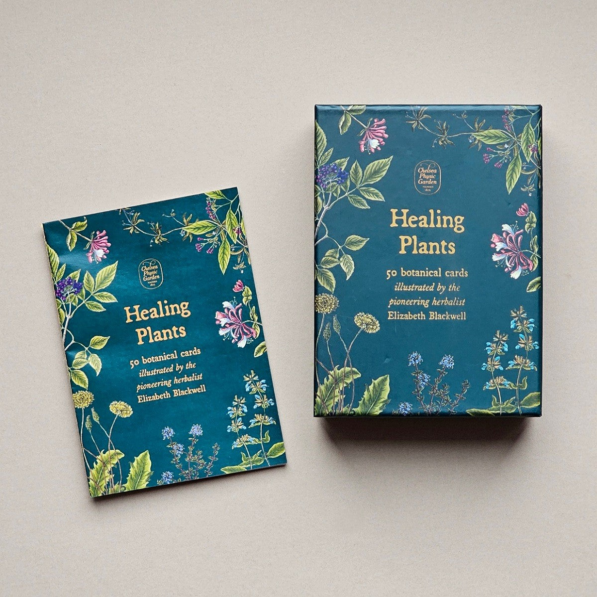 Box and information sheet of 'Healing Plants' cards with floral designs on a light grey background