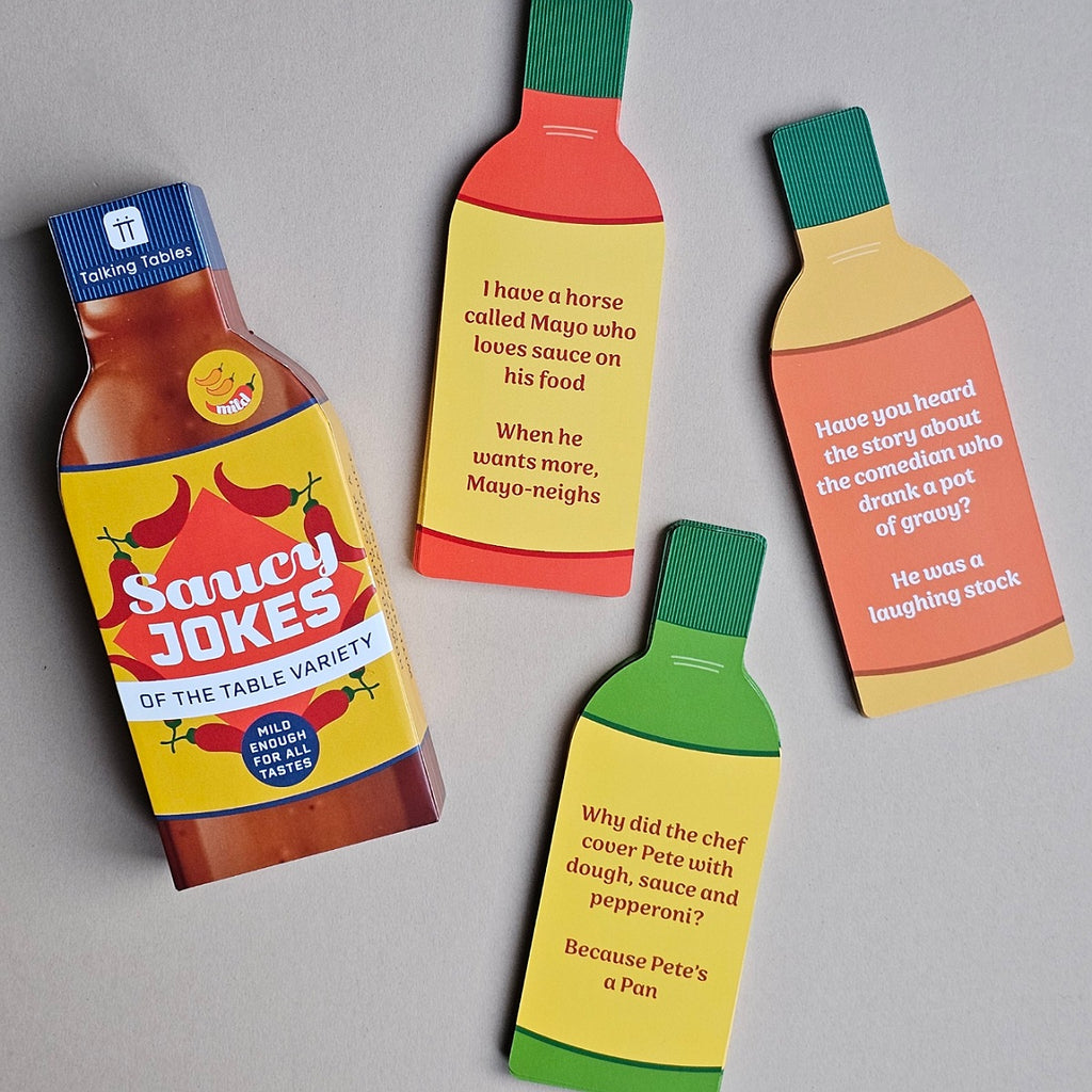 Saucy Jokes bottle-shaped cards with humorous text on a gray background