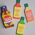 Saucy Jokes bottle-shaped cards with humorous text on a gray background