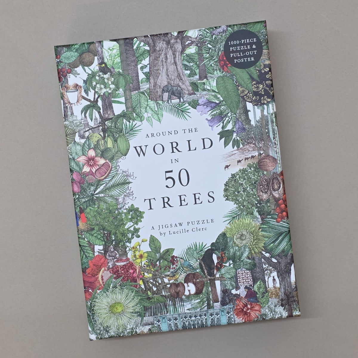 Jigsaw puzzle box titled 'Around the World in 50 Trees' on a plain background