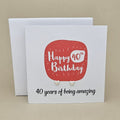 A pair of silver heart earrings displayed on a white card with a red rounded square and the text 'Happy 40th Birthday' and ’40 years of being amazing,'
