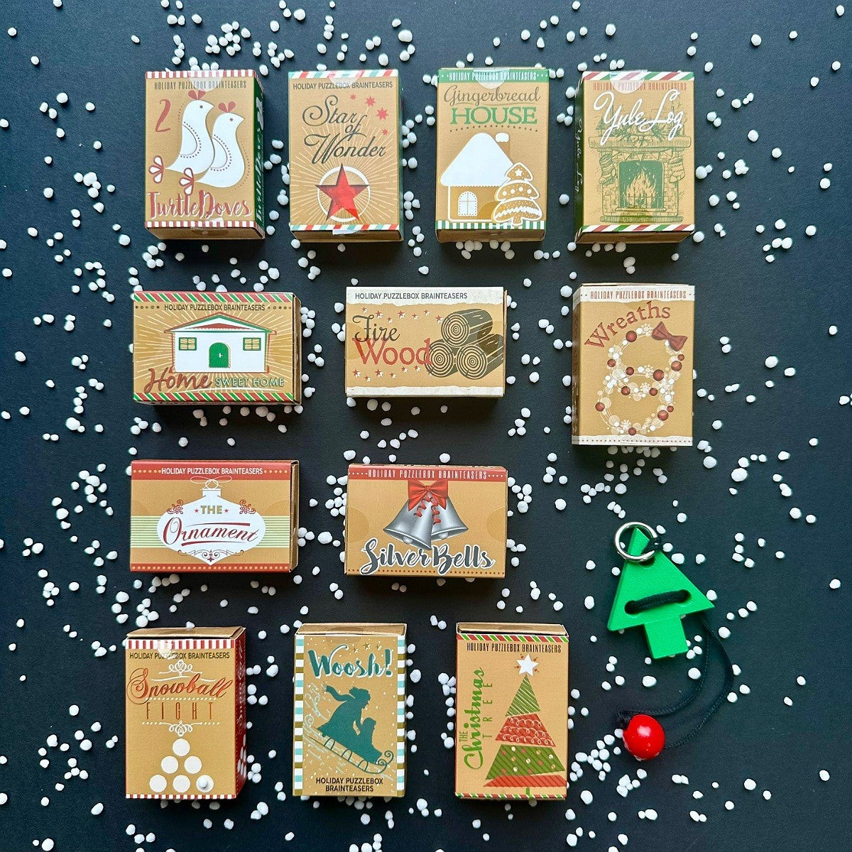 Collection of puzzle decorative boxes with Christmas-themed designs on a dark background with puzzle showing and snow flake decorations.