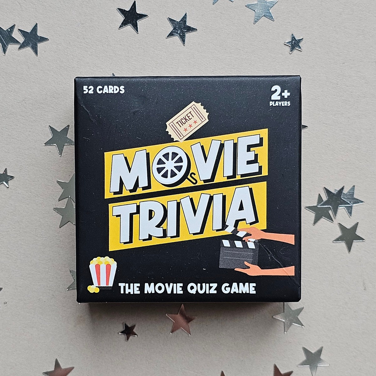 Movie trivia game box with stars on a gray background
