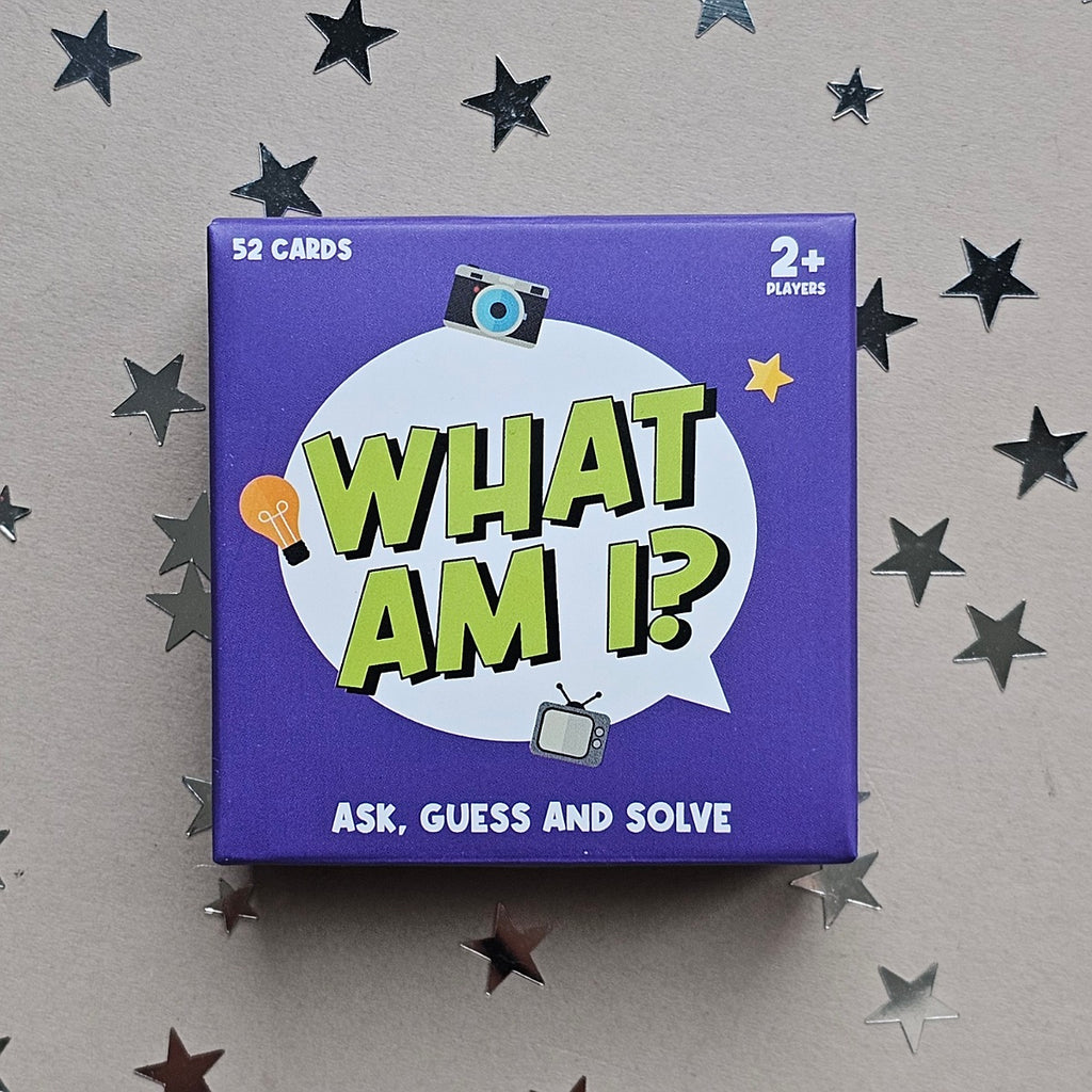 Card game box titled 'What Am I?' on a gray background with star decorations