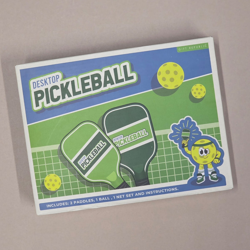 Packaging of Desktop Pickleball set with paddle graphics and text on a beige background