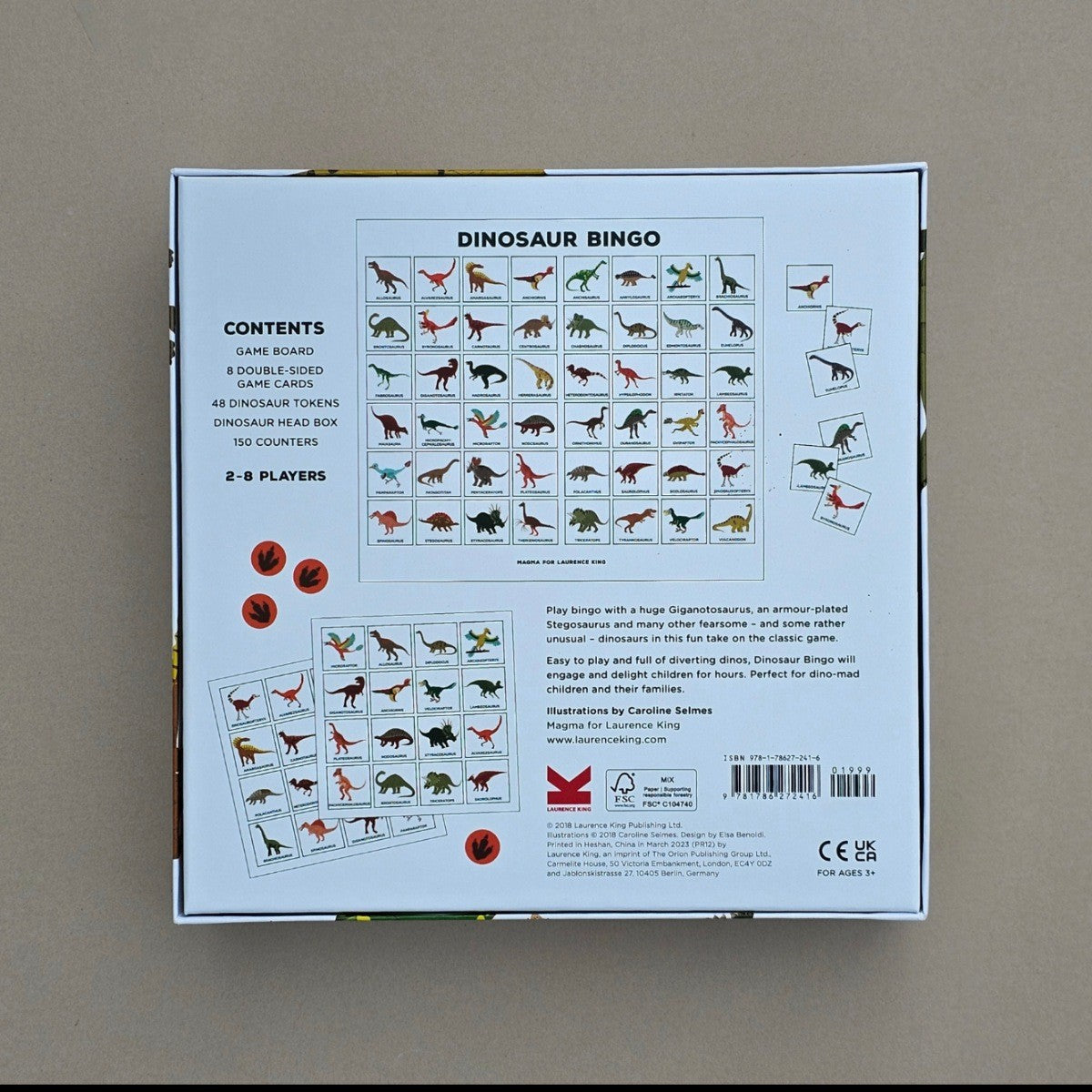 Dinosaur Bingo game box with content details on a beige background