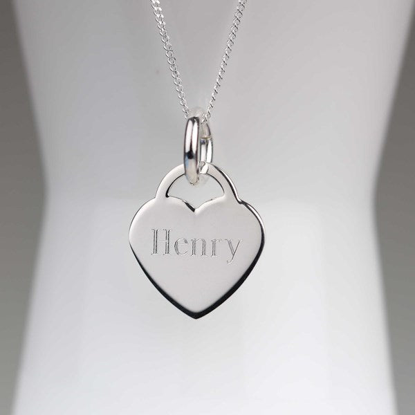 A silver heart-shaped pendant necklace engraved with the name 'Henry', displayed on a white mannequin bust against a soft gray background.