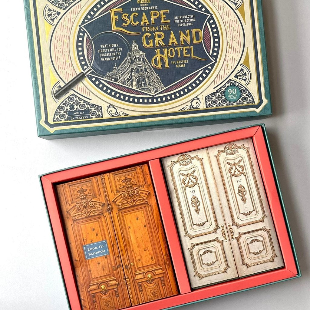 Escape from the Grand Hotel mystery hotel game set, showing the illustrated outer box lid and an open box with two hotel doors inside.