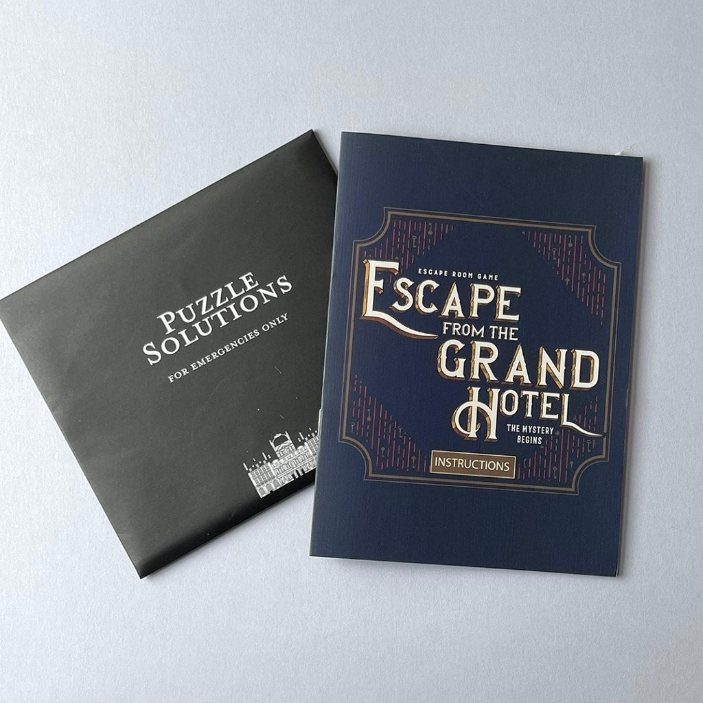 Two books titled 'Puzzle Solutions' and 'Escape from the Grand Hotel' on a light grey background