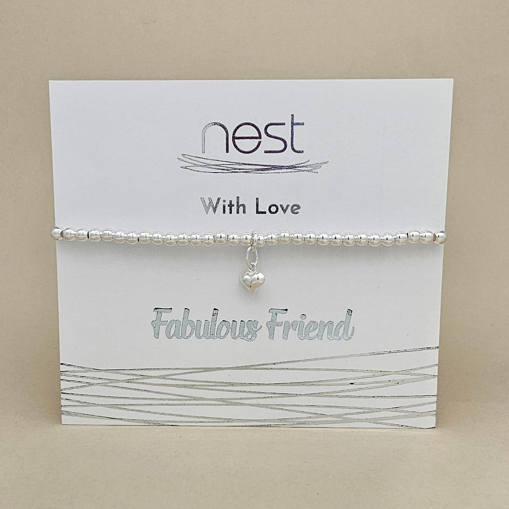 Silver bracelet with a heart charm on a 'nest' branded card.