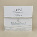 Silver bracelet with a heart charm on a 'nest' branded card.