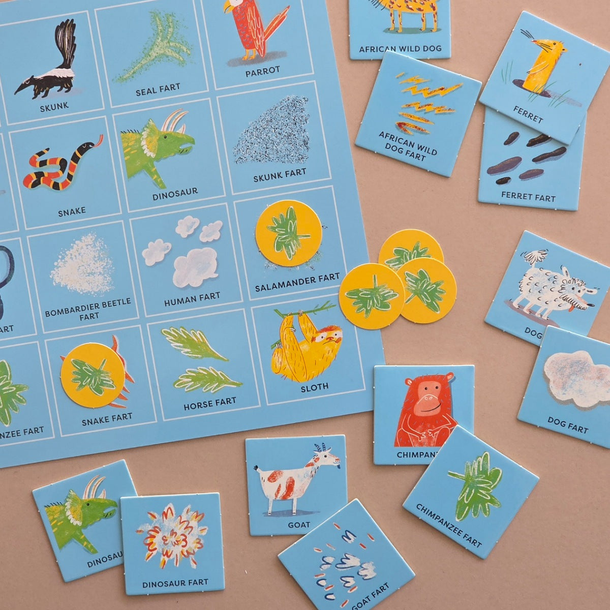 Educational bingo card game with animal-themed cards on a brown background