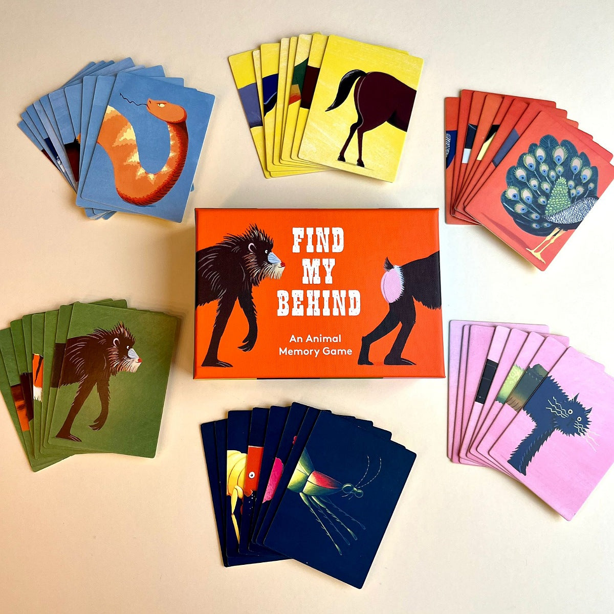 Animal memory game 'Find my Behind' with cards and box on a light background