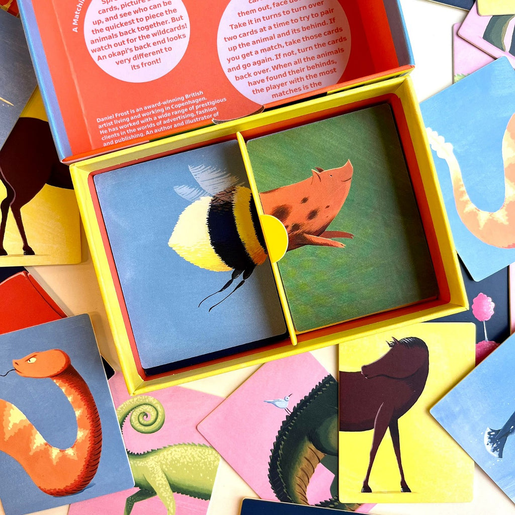 Colorful animal-themed card game with open box showing bee and fish cards.