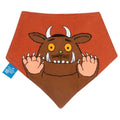 A terracotta orange baby bandana bib featuring a large embroidered brown monster character with white horns, yellow eyes, and raised paws. A small blue tag with the brand name 'The Little Gruffalo' is visible on the left side.