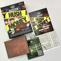 Puzzle game components including a wallet, cards, and a manual on a white background