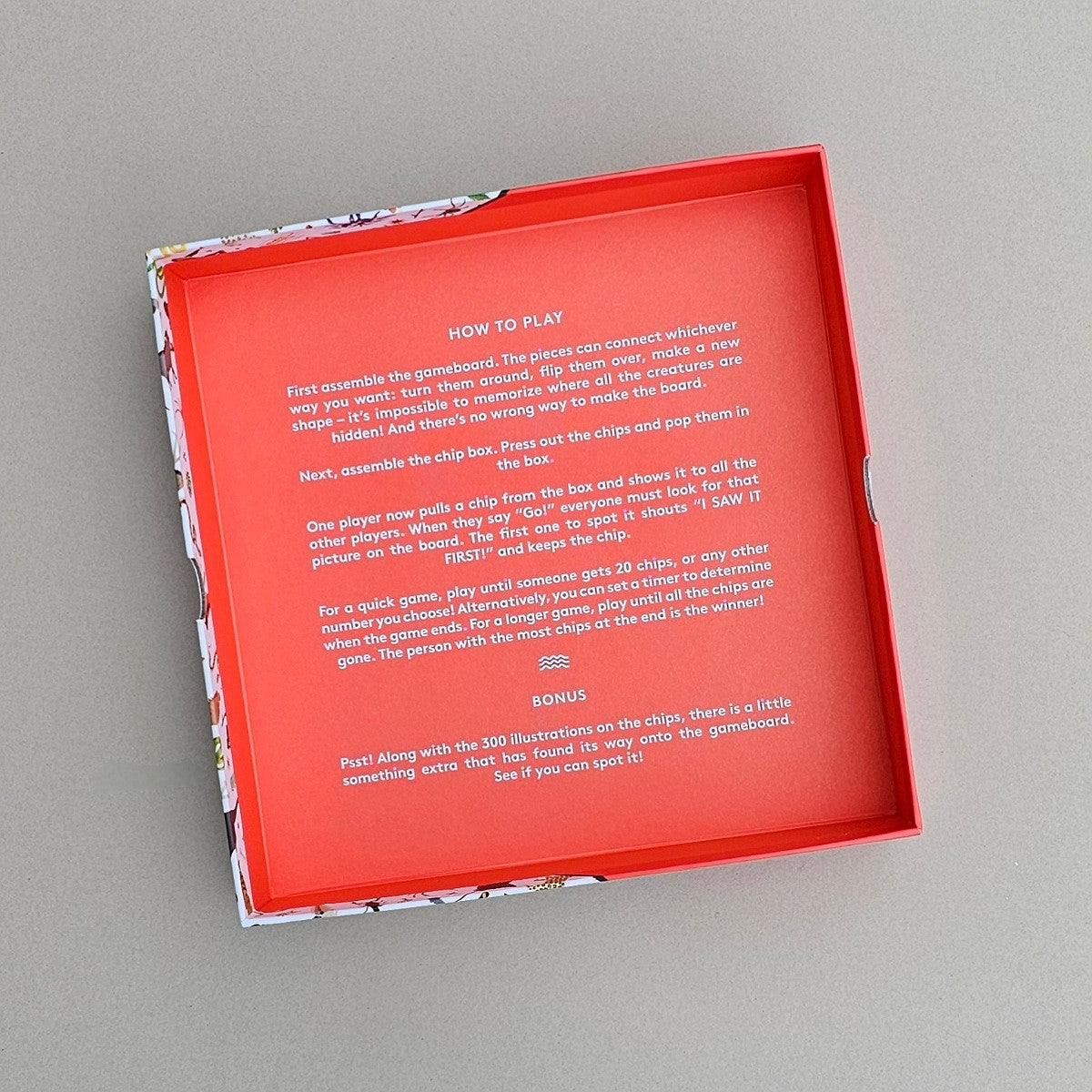 Inside red game box with instructions on a grey background