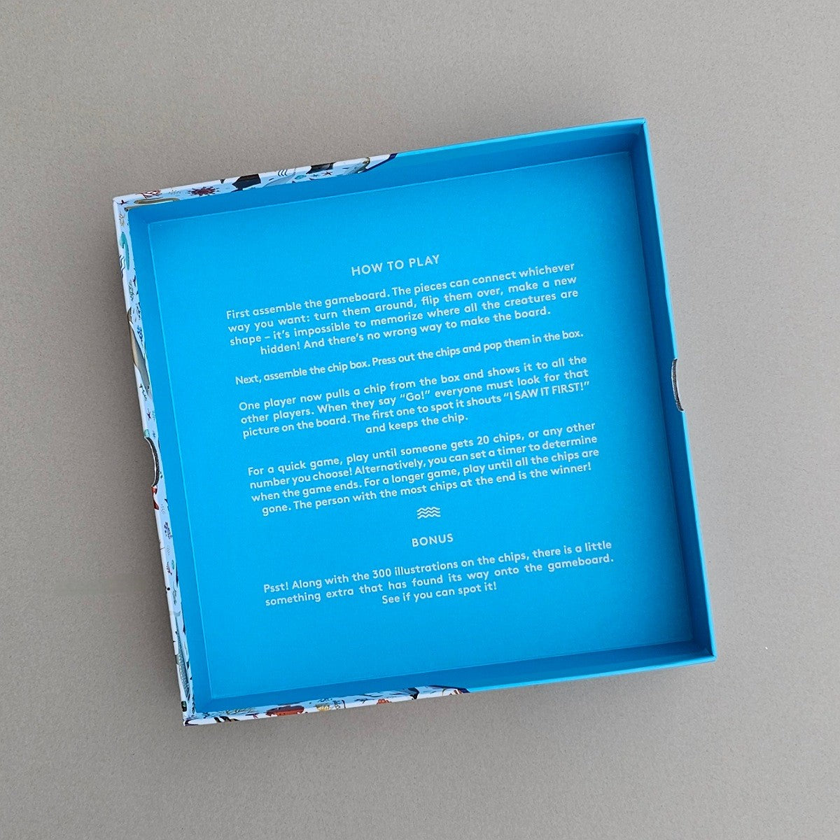 Inside blue box game board with 'how to play' on a grey background