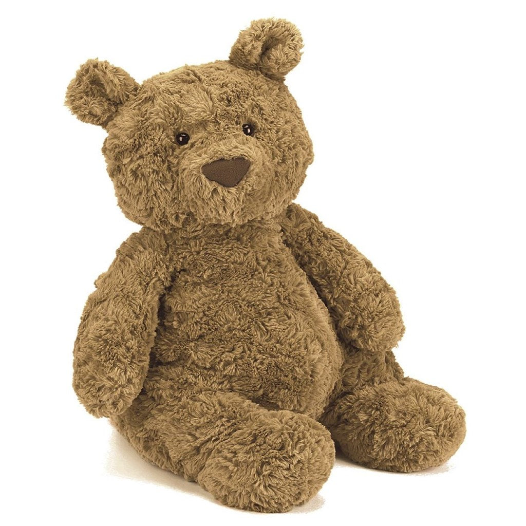 Stuffed fluffy teddy bear, brown in colour on a white background