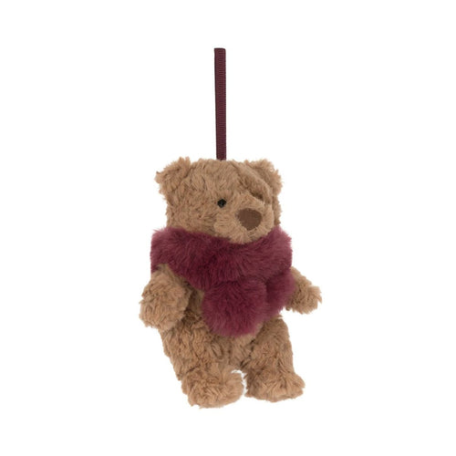 A small plush teddy bear ornament or hanging decoration in tan with a fuzzy burgundy scarf and a matching hanging loop, shown on a plain white background.