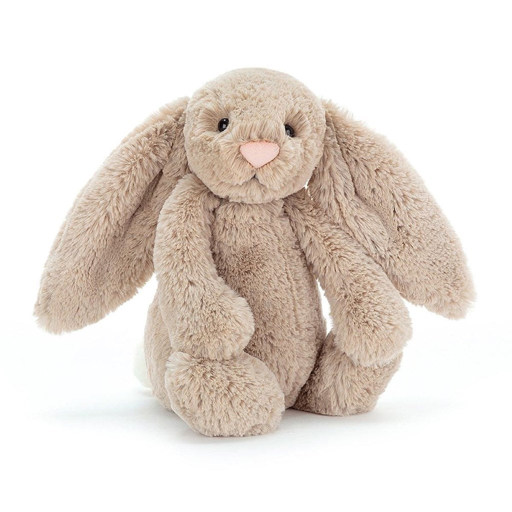 Plush bunny toy with a soft beige colour on a white background