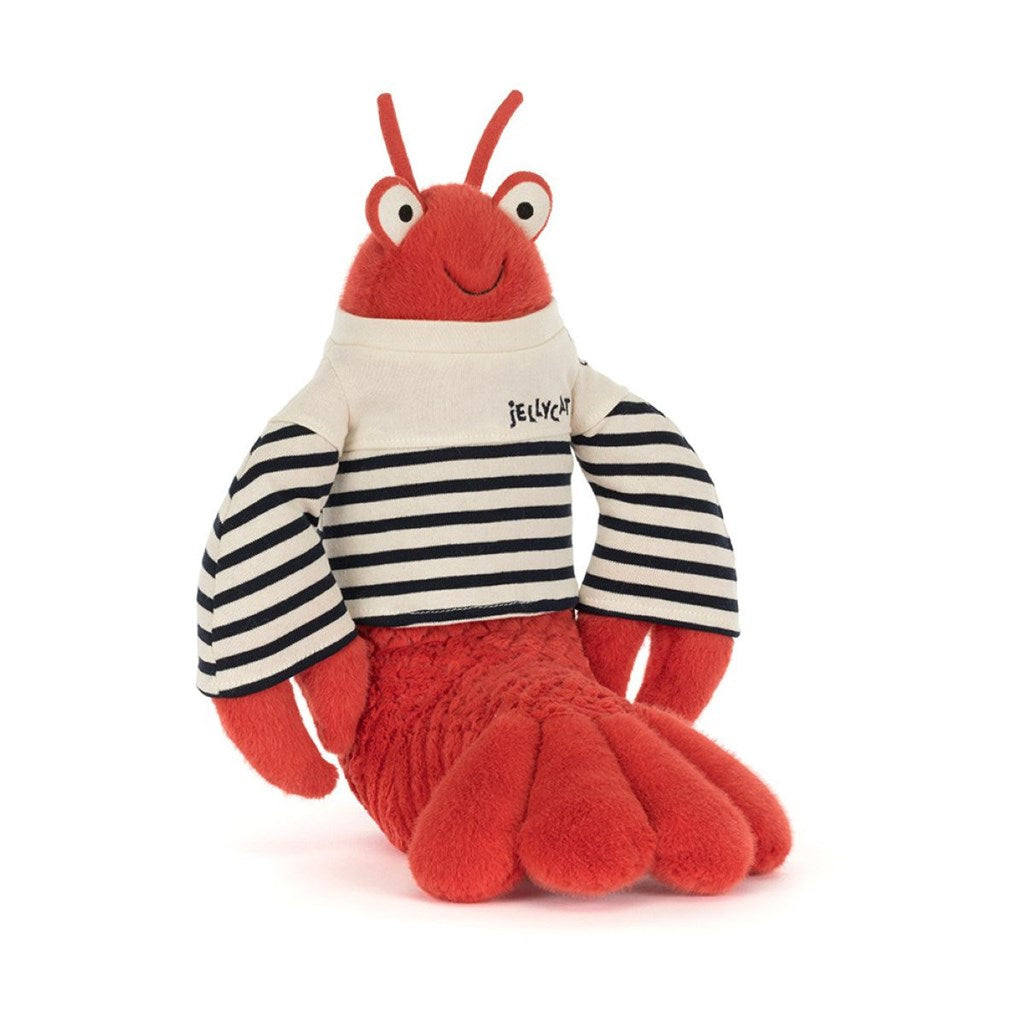 Plush toy orange lobster with a cream and navy striped shirt on a white background