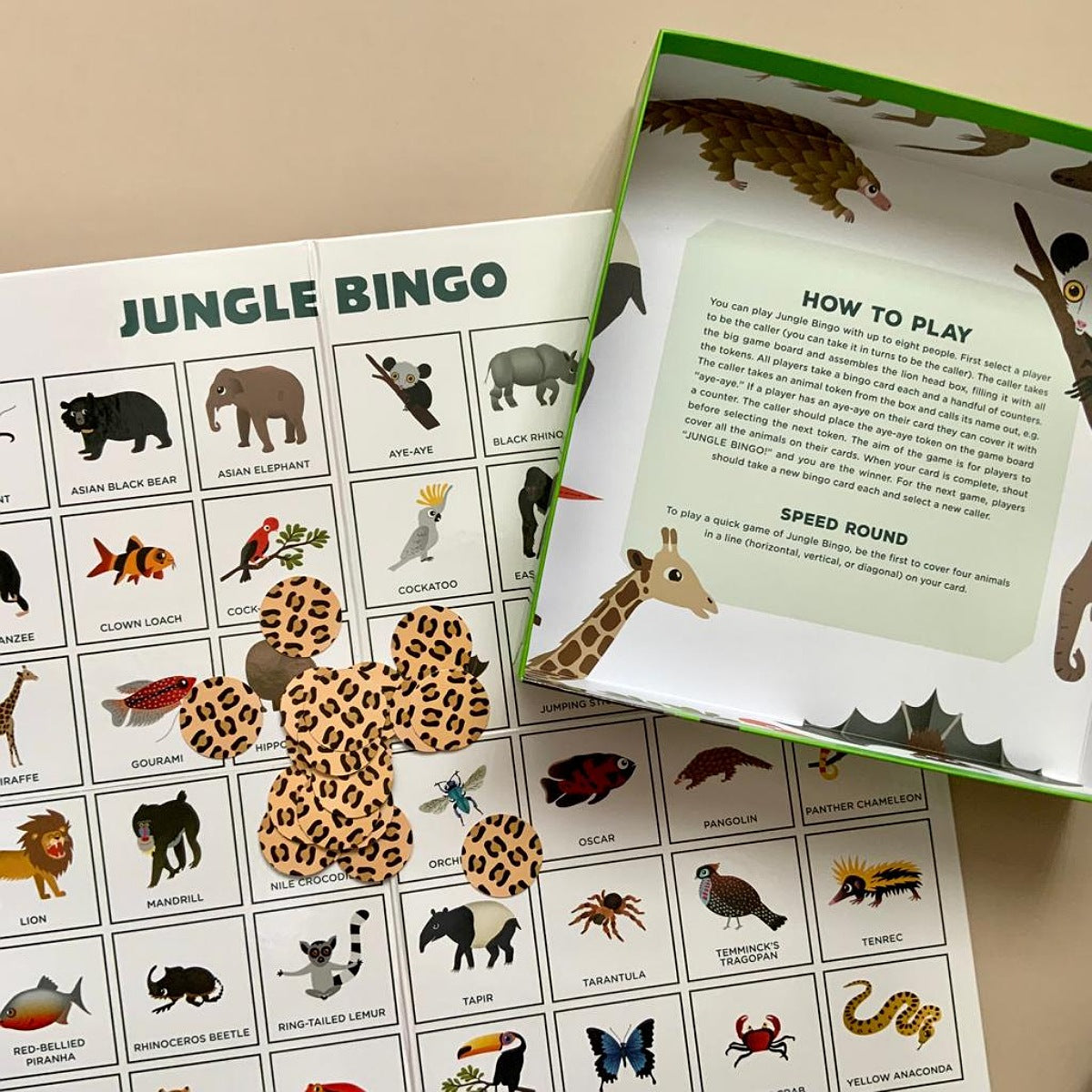 Jungle Bingo game with how to play instructions on a beige surface