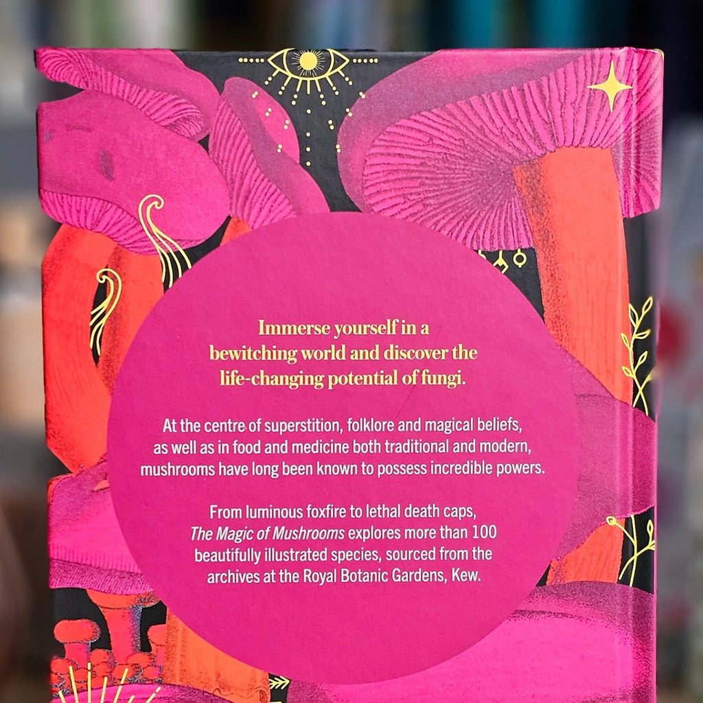 Book back cover with pink and orange design, text about mushrooms, and a blurred background.