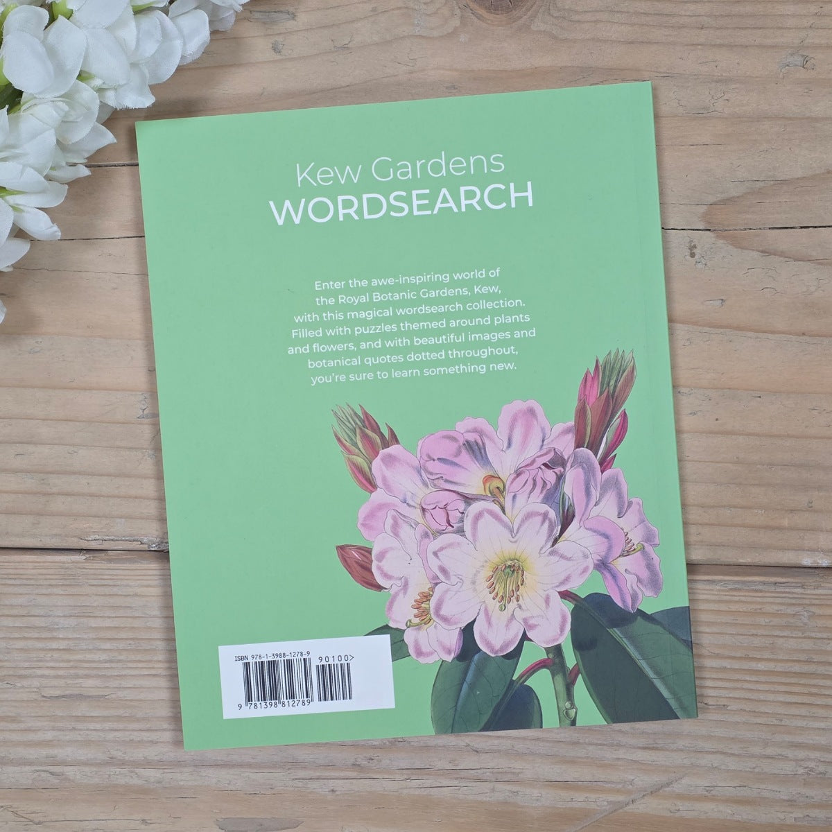 Kew Gardens Wordsearch book cover with floral illustration on a wooden surface