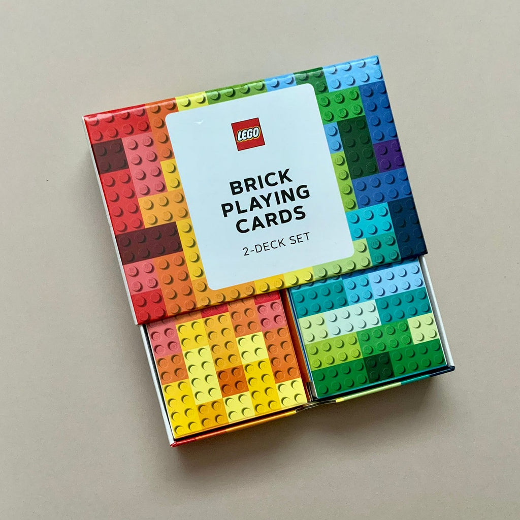 LEGO Brick Playing Cards 2-Deck Set in its original packaging, featuring a colorful grid of building brick studs on the box cover and a white label with the red LEGO logo.