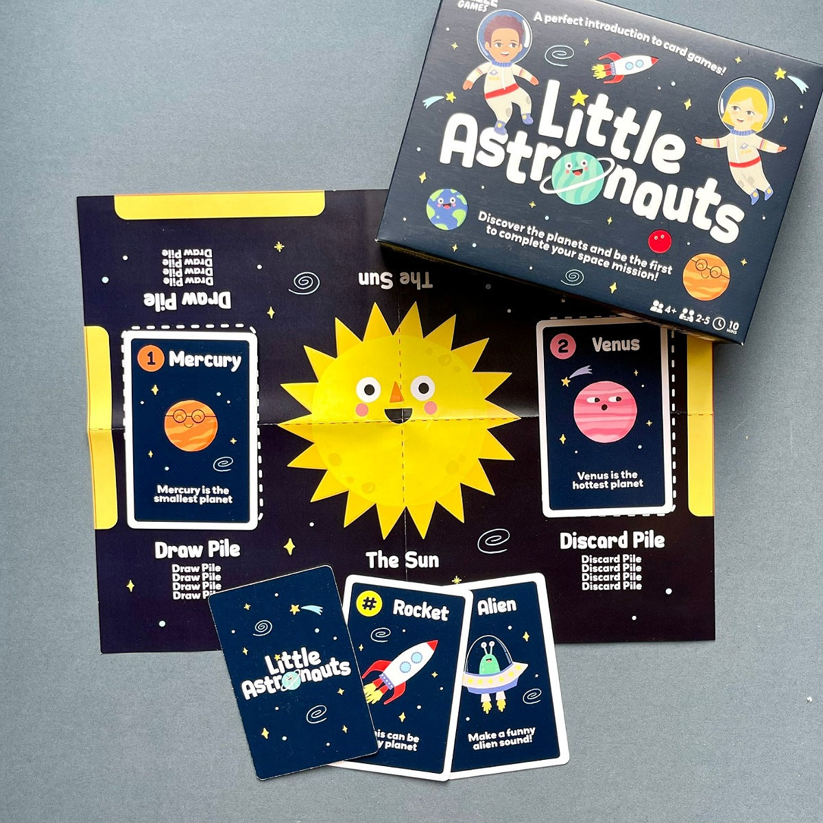 Children's card game set titled 'Little Astronauts' on a grey background