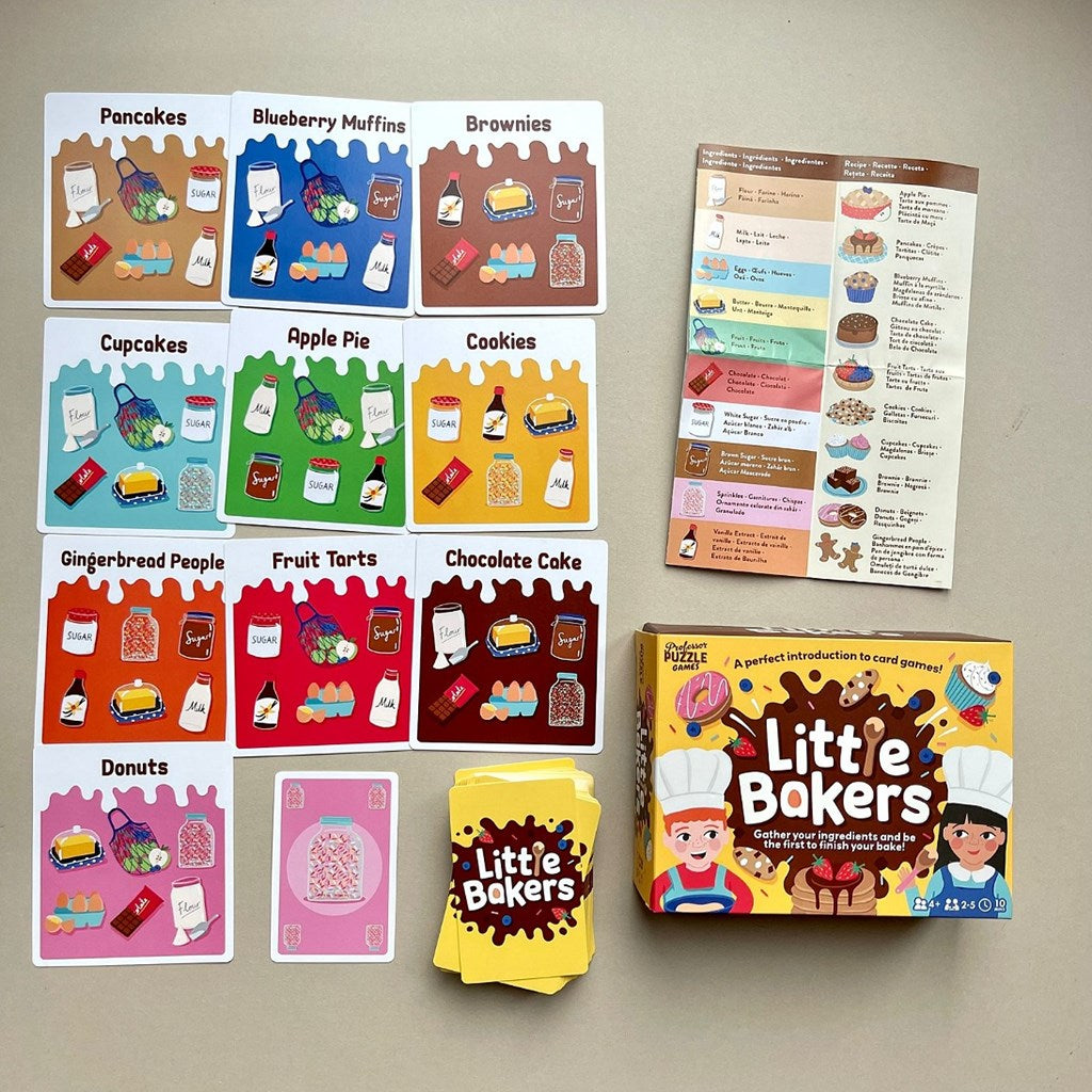 Collection of 'Little Bakers' card games and packaging on a beige surface
