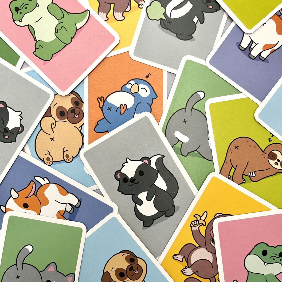 Collage of colorful cards with cartoon animals on a light background