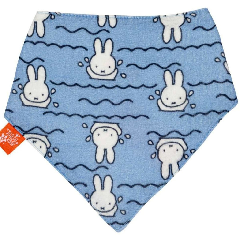 A triangular baby bandana bib in light blue, featuring a repeating pattern of white Miffy the rabbit swimming in water waves. A small orange brand tag is visible on the left edge.