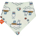 A triangular baby bandana bib made of soft fleece, featuring a white background with a colorful cartoon print of Miffy the rabbit, boats, and beach balls. A small orange tag is visible on the left edge.