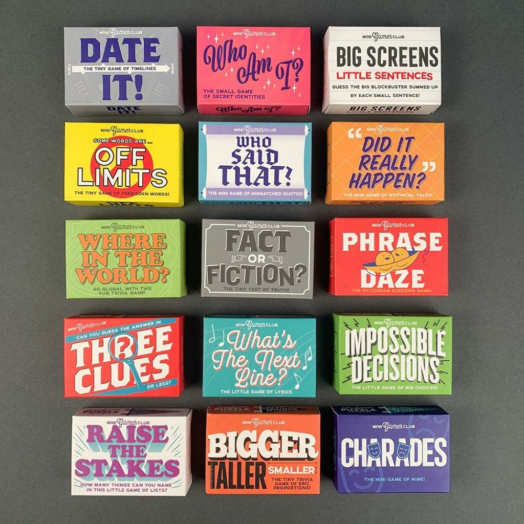 Collection of matchbox sized family games on a grey background