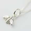 Silver bee charm on a white background