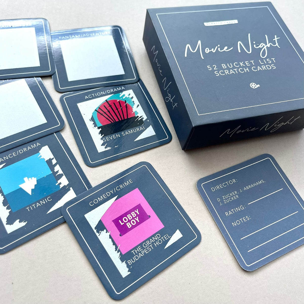 Movie Night scratch cards with a box on a light surface