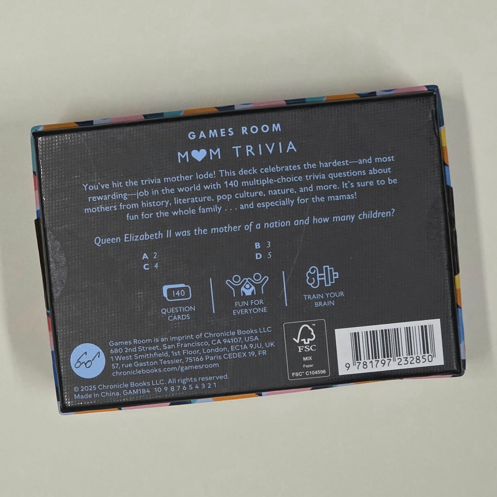 Back of a card game box with text and branding on a light grey background