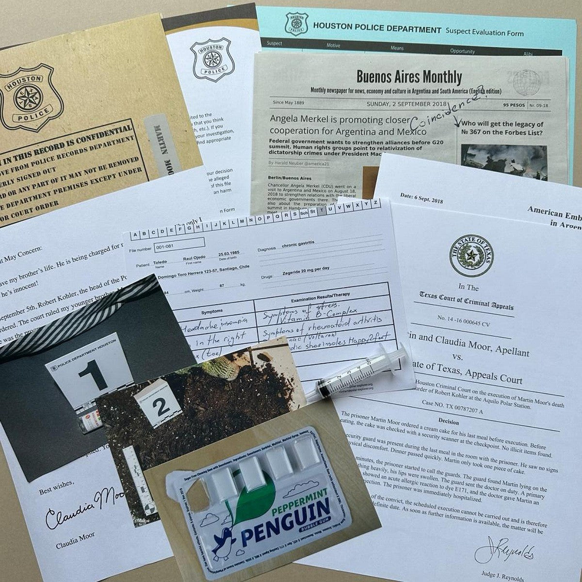 Collection of documents and a small package on a surface