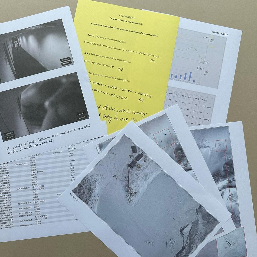 Collection of printed documents and photographs on a flat surface