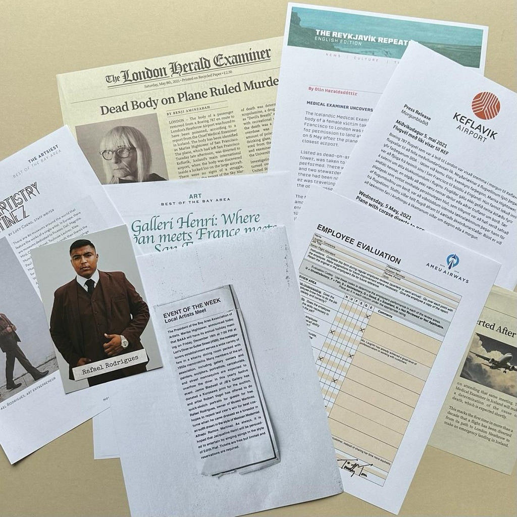 Collection of various printed documents on a beige surface