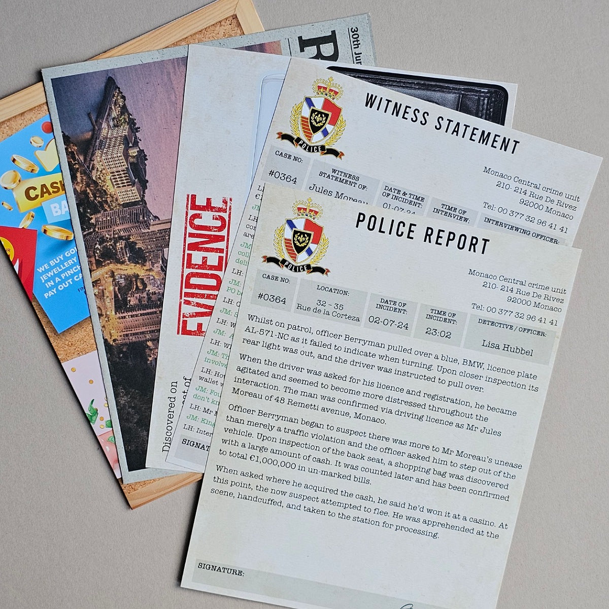 A stack of printed document samples or templates lies on a light surface, with the top sheet prominently reading "WITNESS STATEMENT" and "POLICE REPORT," plus a smaller document showing a temple scene and a colorful card with a blue and yellow design.