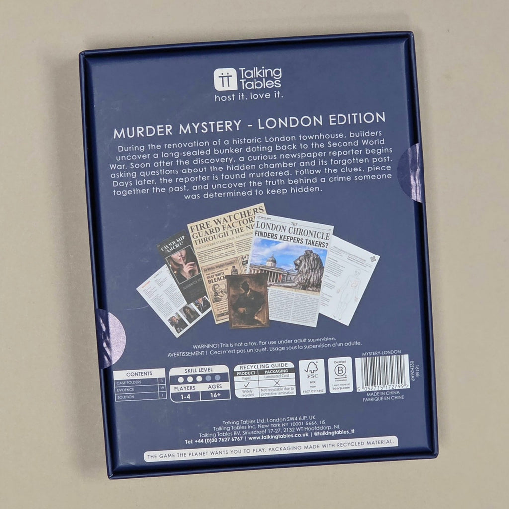 The back of the 'Murder Mystery - London Edition' game box, photographed from above on a neutral beige surface. The box is dark blue with white text and a small newspaper collage graphic.