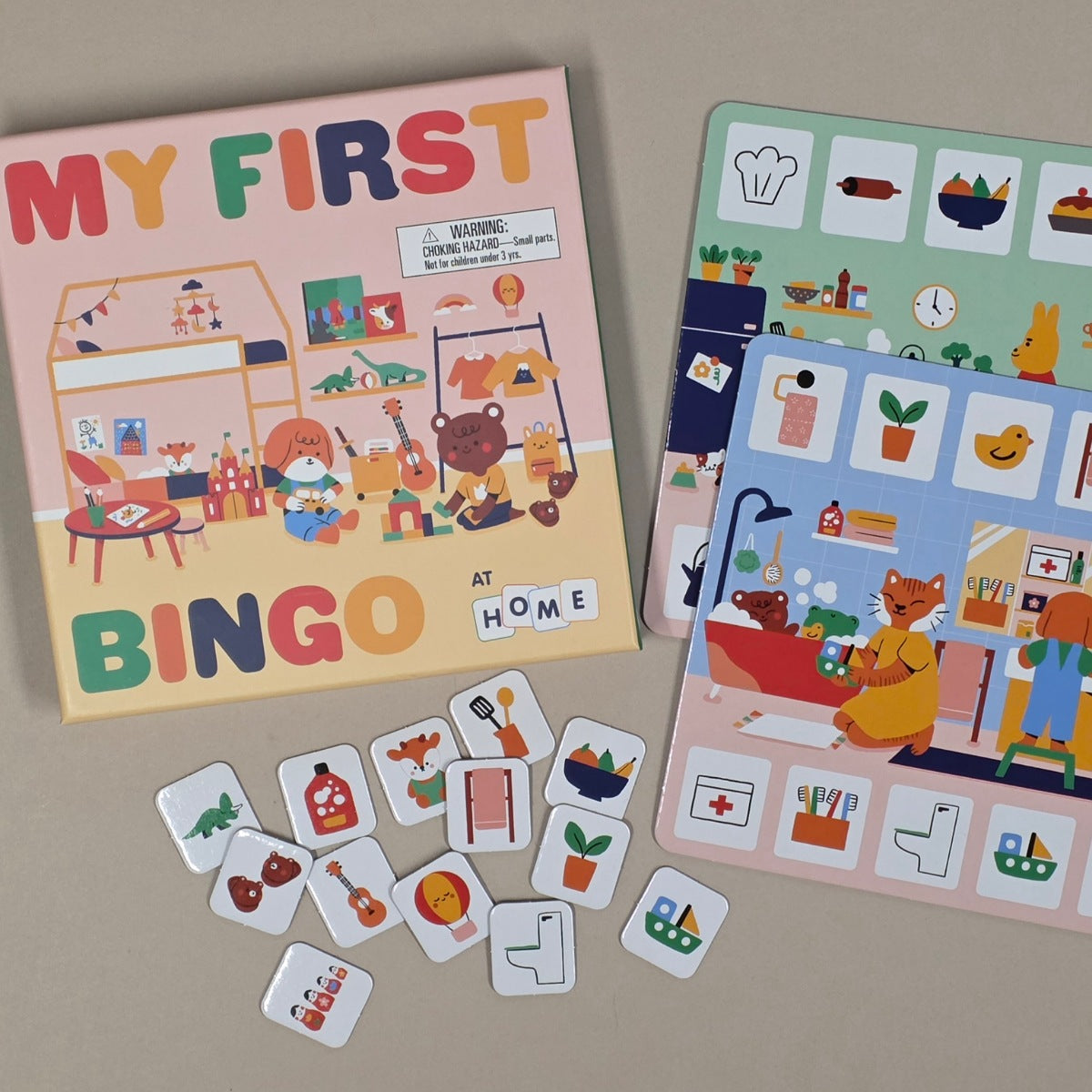 Children's my first bingo game with cards and pieces on a beige surface