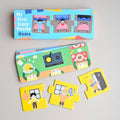 A children's jigsaw puzzle set titled 'My First Story Puzzle Home' shown with its illustrated box, unfolded puzzle board, and several loose puzzle pieces on a light grey surface.