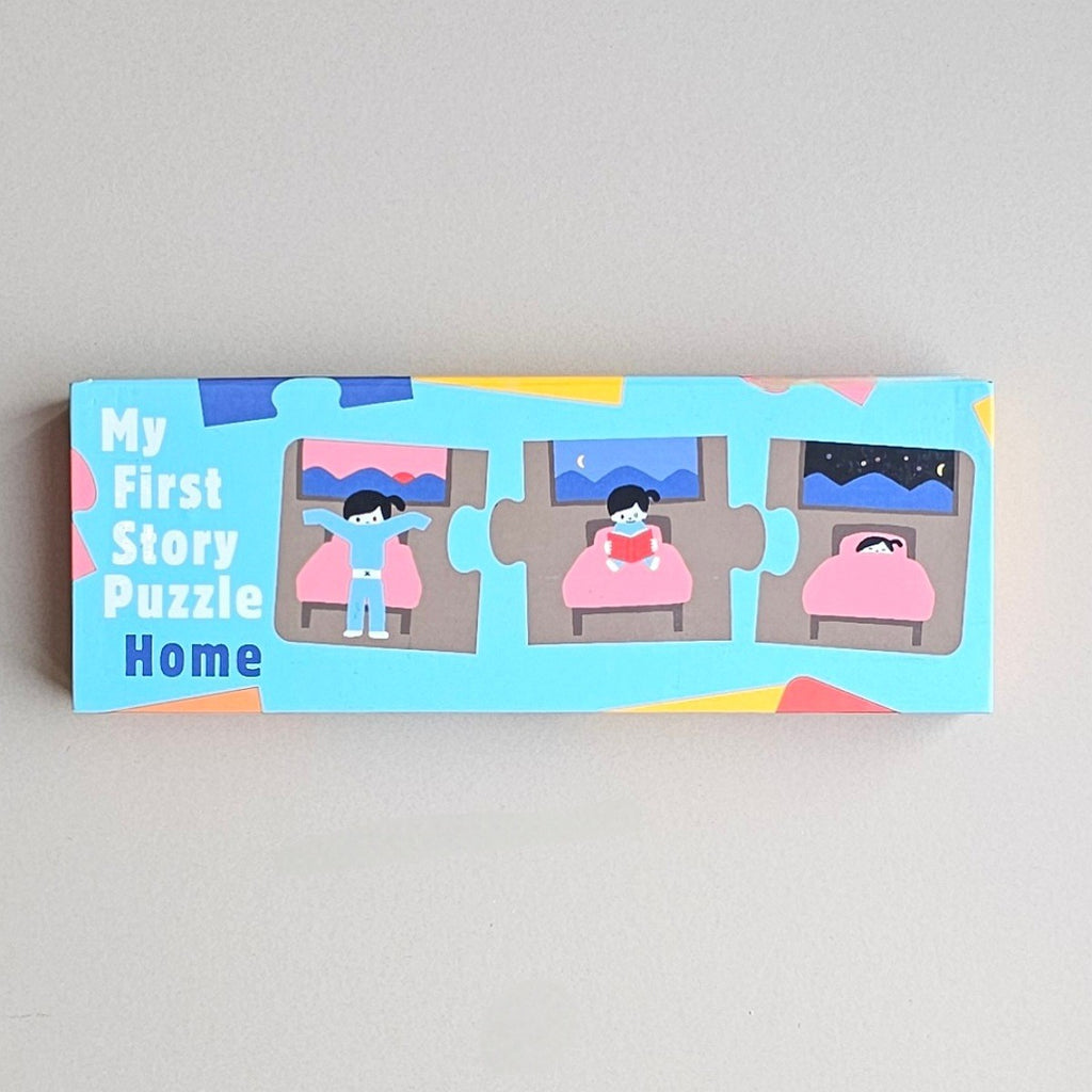 Children's jigsaw puzzle box with illustrations of a child reading a book in different rooms, on a light grey background.